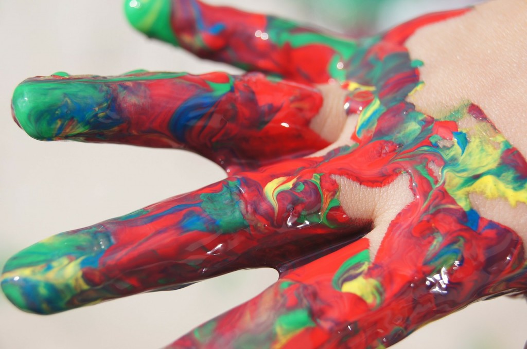 child development, image of child's hand with fingerpaint